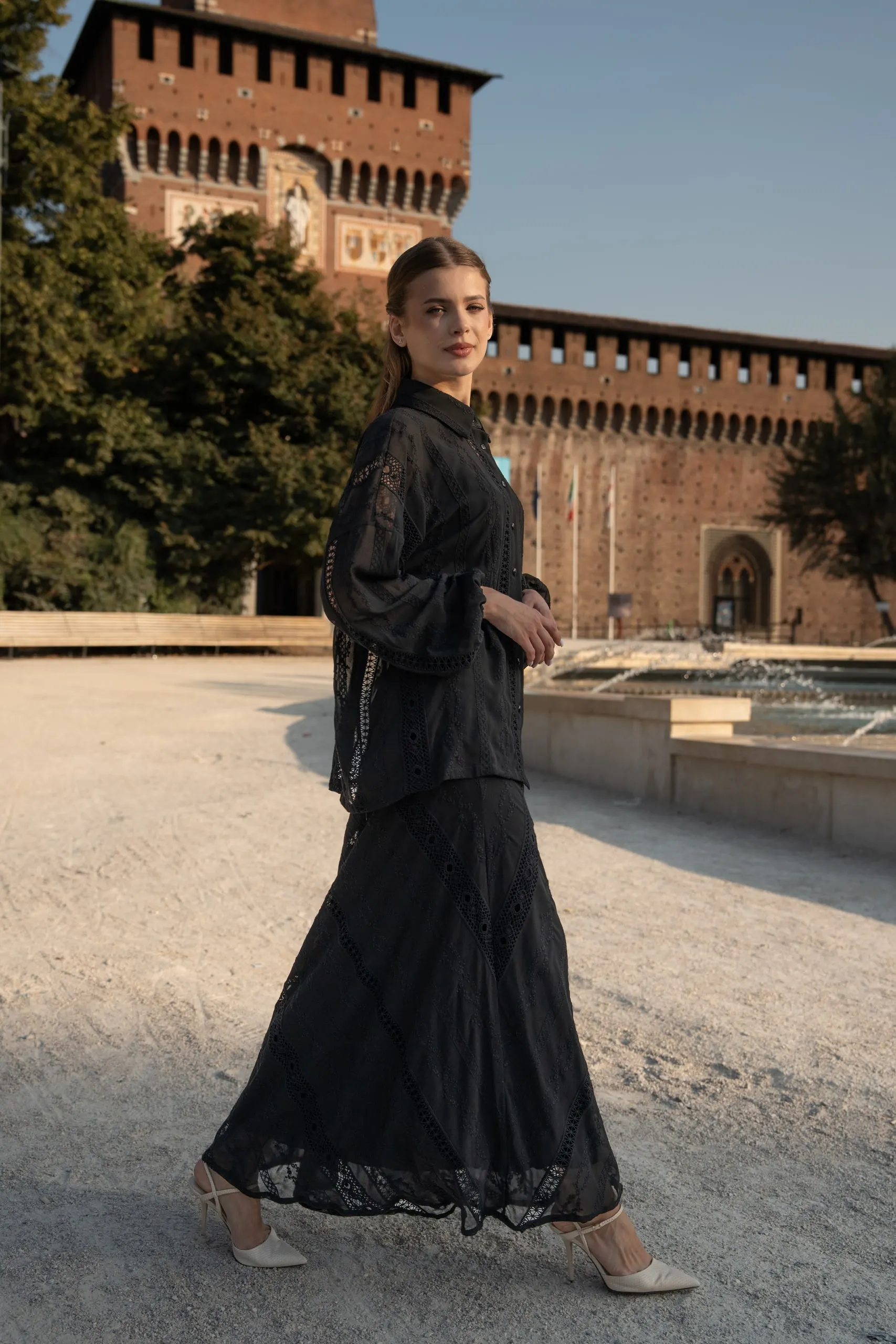 Atelier èmi — black lace dress at the Castello Sforzesco