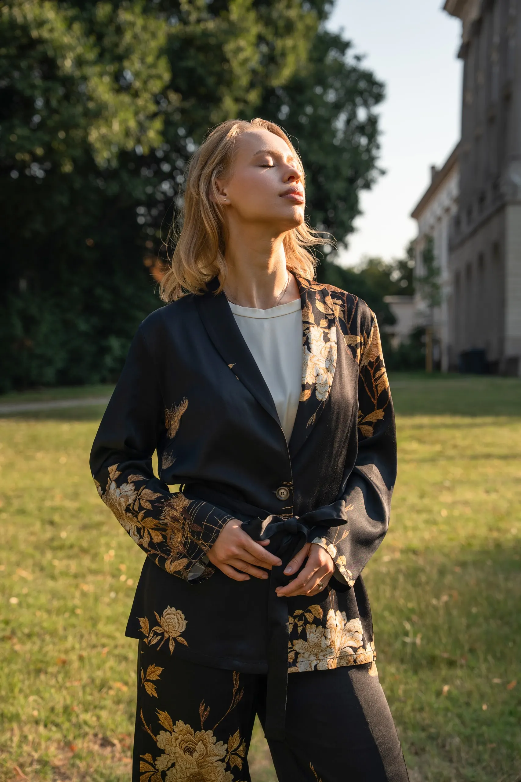 Clothé — black floral suit, front