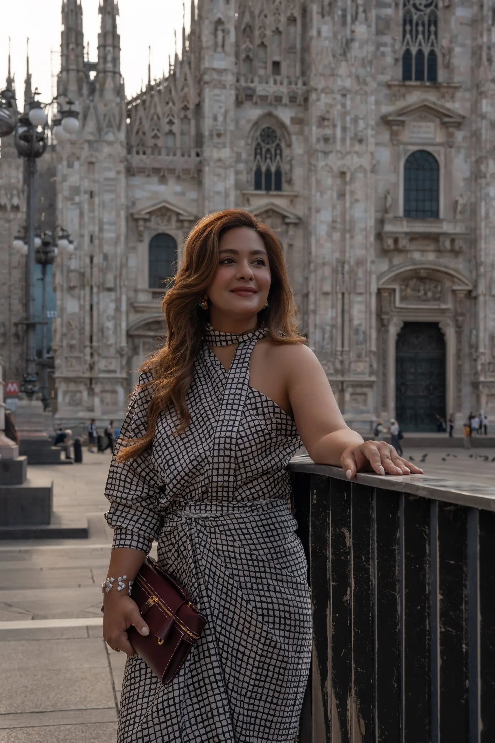 Megha Sehra — a shoot in Milan — by the Duomo in a checked set