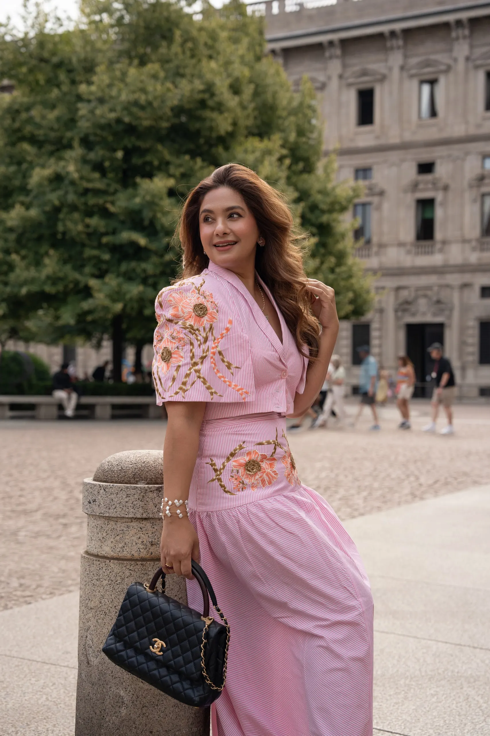 Megha Sehra — a shoot in Milan — with her bag on a Milan street