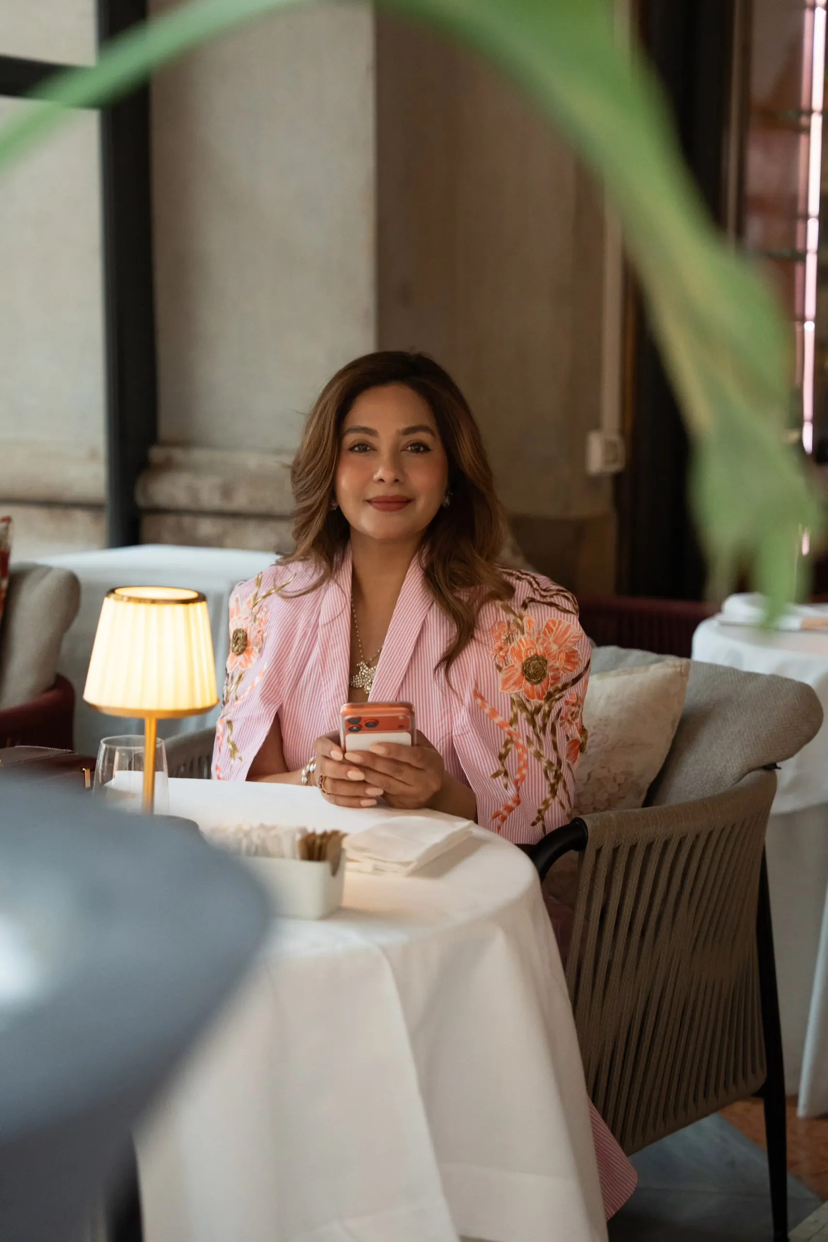 Megha Sehra — a shoot in Milan — at a café table