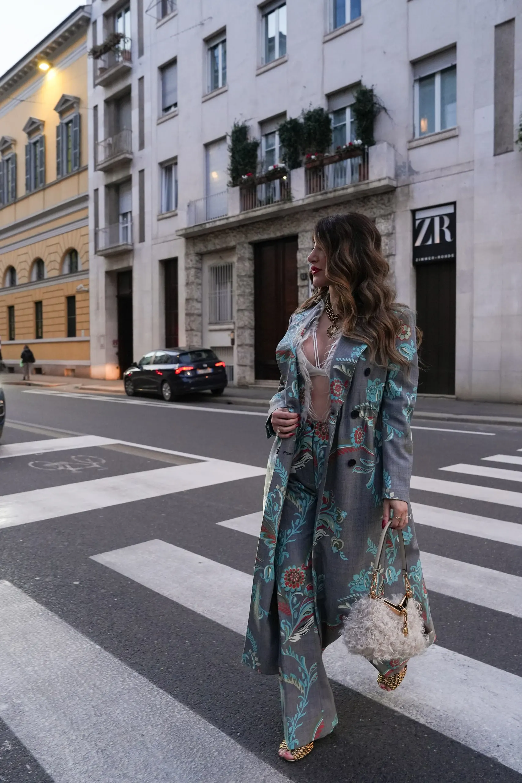 Tina Taymoor — Milan Fashion Week — crossing by the palazzo