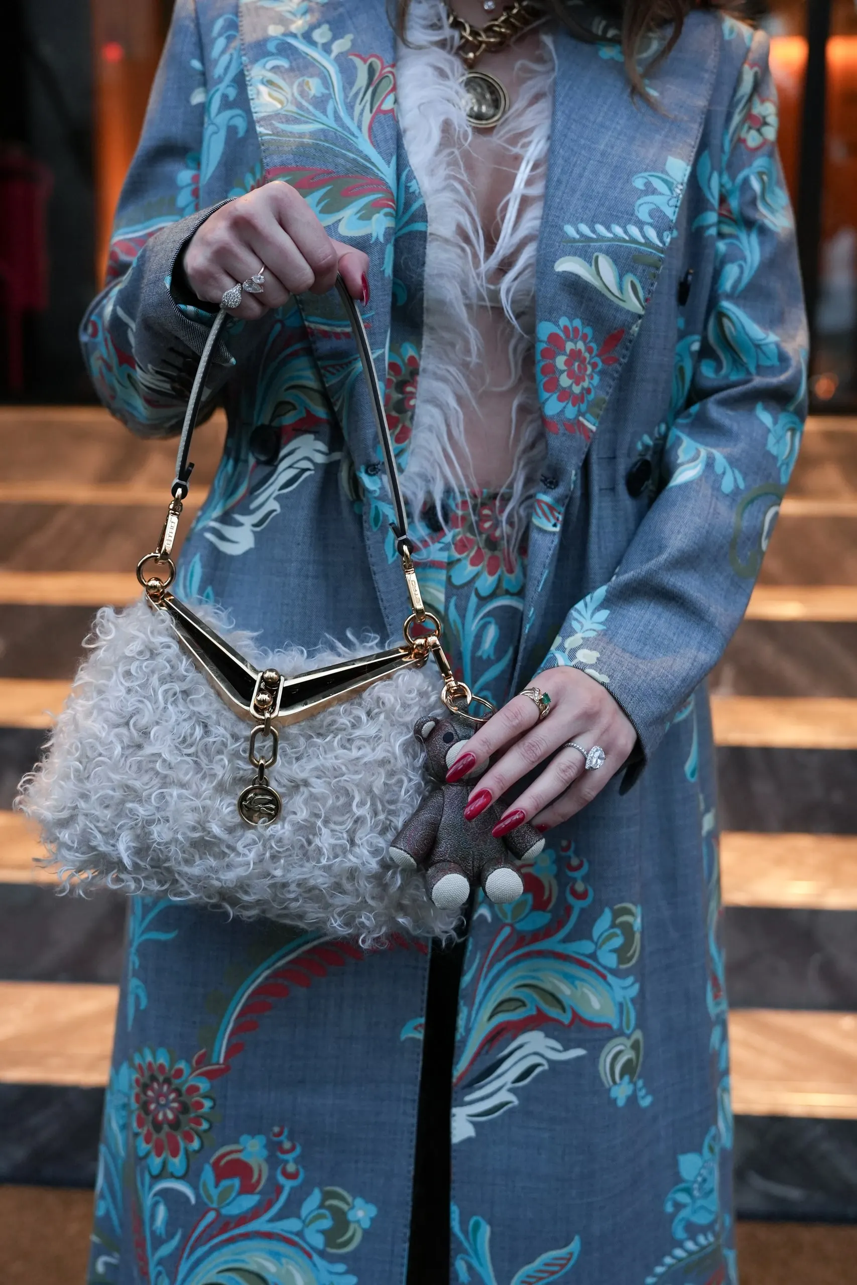 Tina Taymoor — Milan Fashion Week — detail of the suit and the fur bag