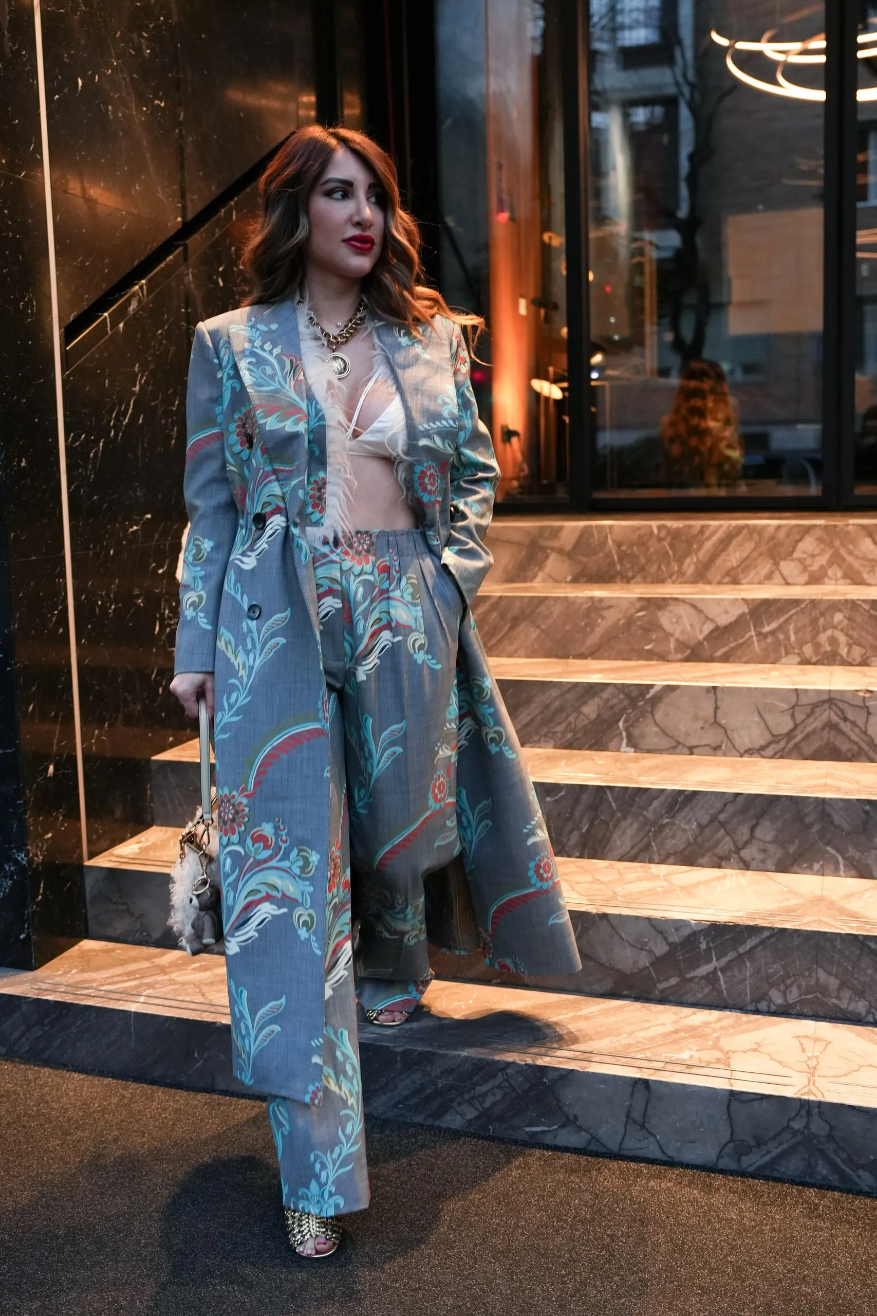 Tina Taymoor — Milan Fashion Week — coming down the steps
