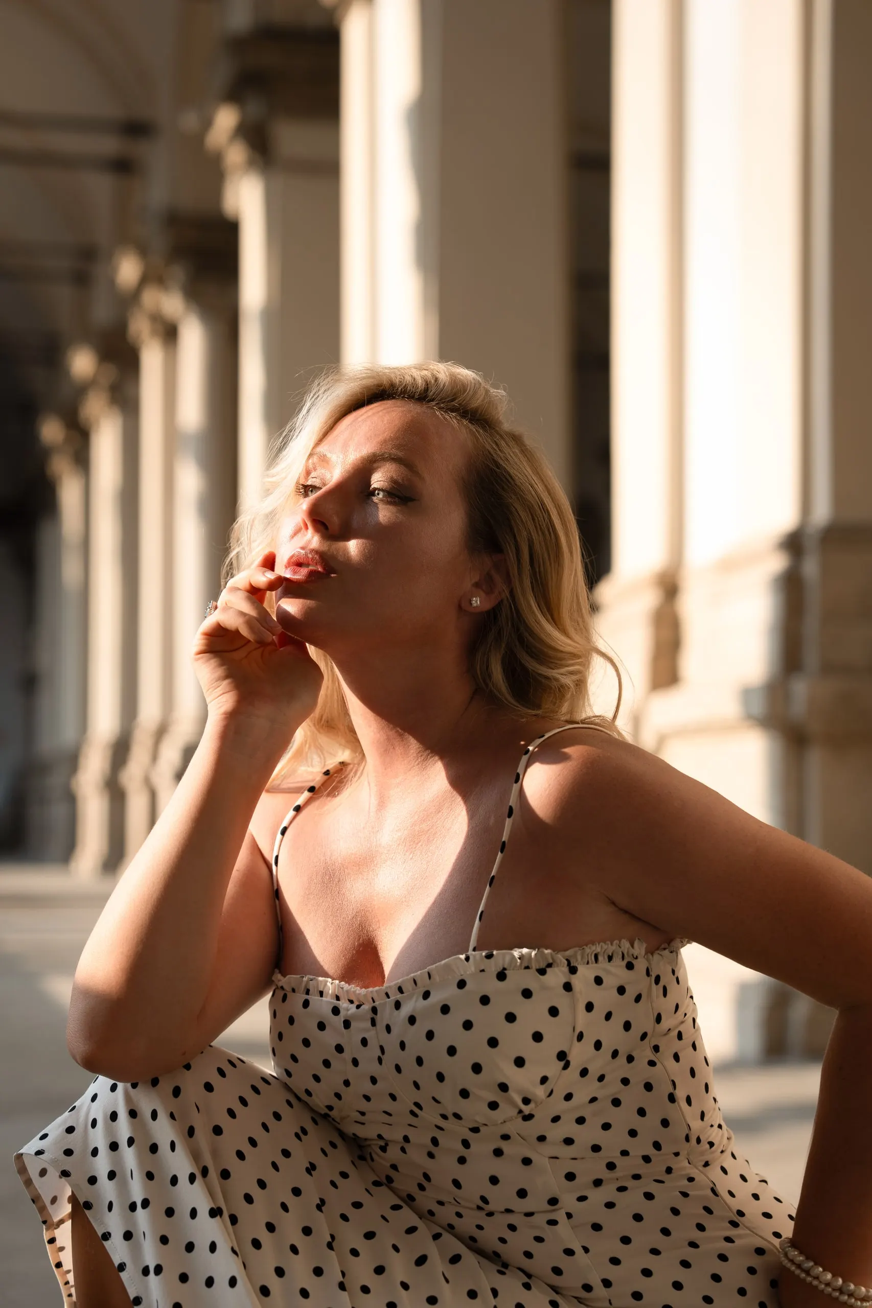Yulia — a private shoot in Milan — hand to her face in the sun